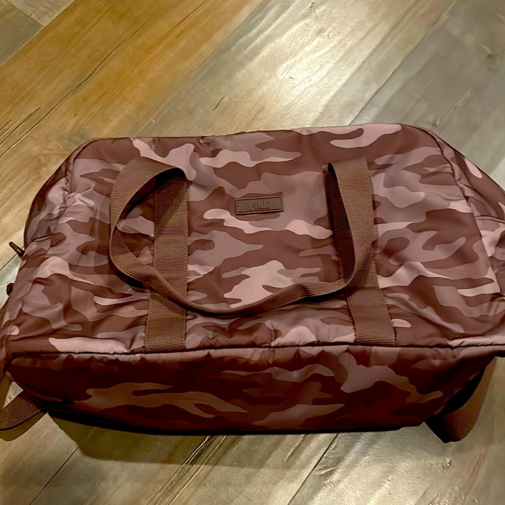 Pink brand camo duffel bag